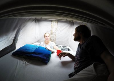 Couple on the top bed in campervan