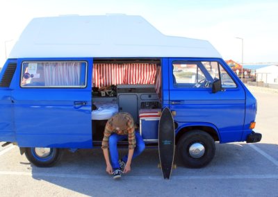 Blue campervan for surf holidays