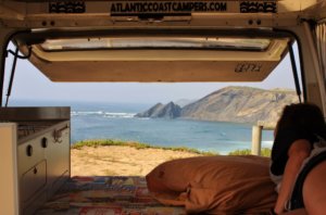 Beach view inside campervan in surf holidays