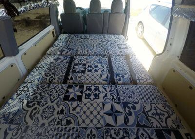 Big bed inside campervan on surf trips